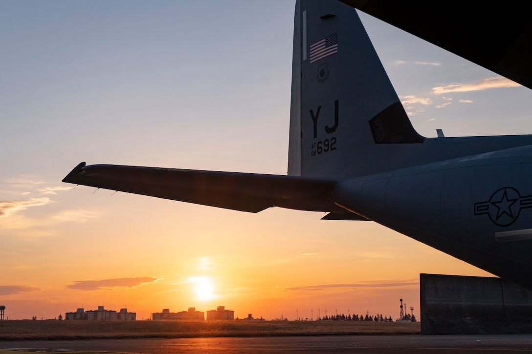 The sun rises over a C-130J Super Hercules assigned to the 36th Airlift Squadron at Yokota Air Base, Japan, Jan. 22, 2021.