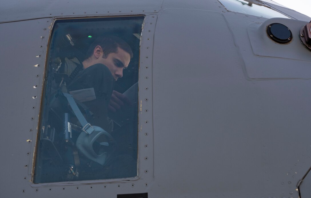 Capt. Bernie Cox, 36th Airlift Squadron C-130J Super Hercules pilot, performs pre-flight checks before conducting an air drop mission in support of Joint Exercise Littoral Strike at Yokota Air Base, Japan, Jan. 22, 2021.