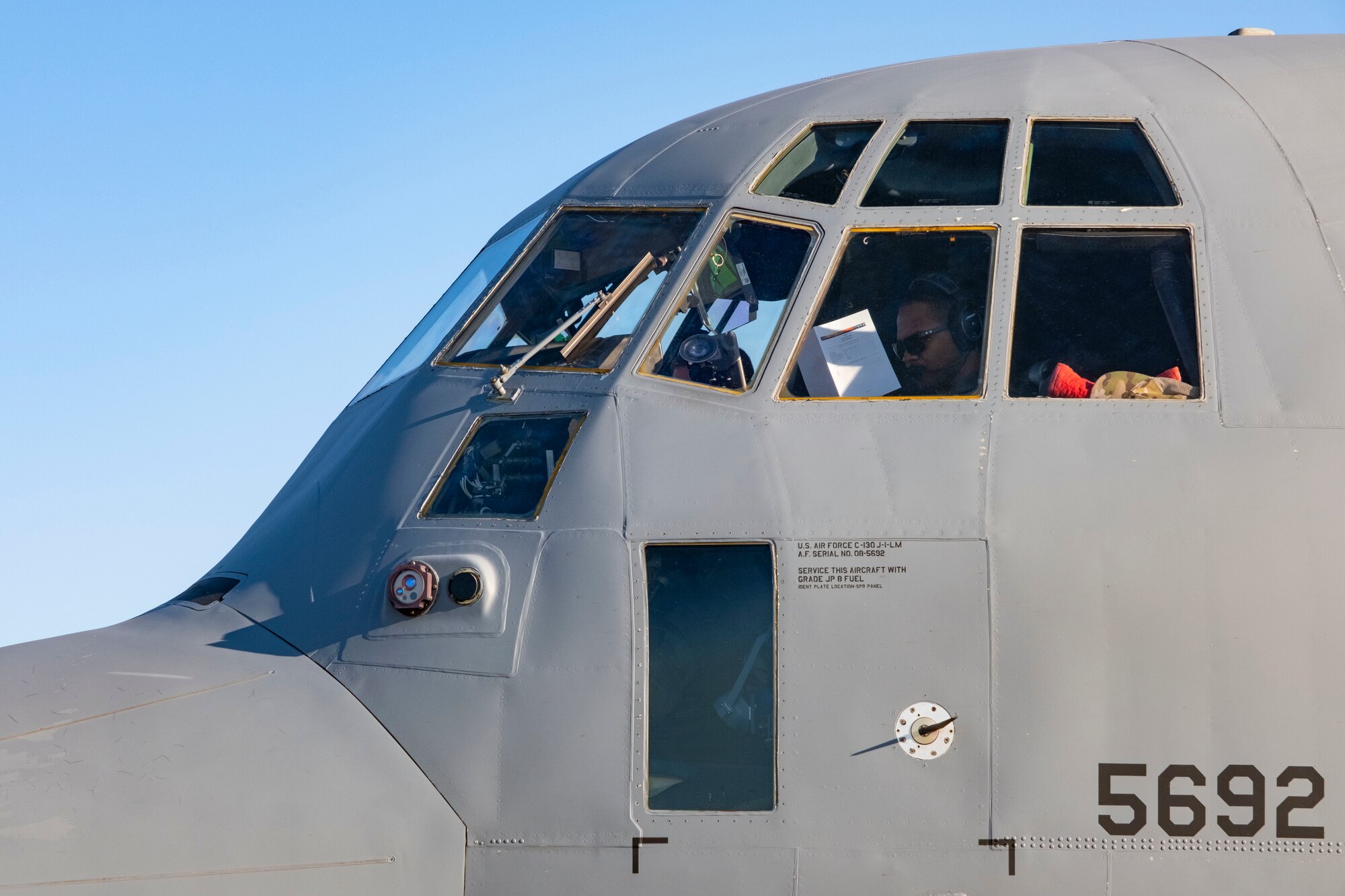 Capt. Jay Lambert, 36th Airlift Squadron C-130J Super Hercules pilot, performs pre-flight checks at Yokota Air Base, Japan, Jan. 22, 2021.
