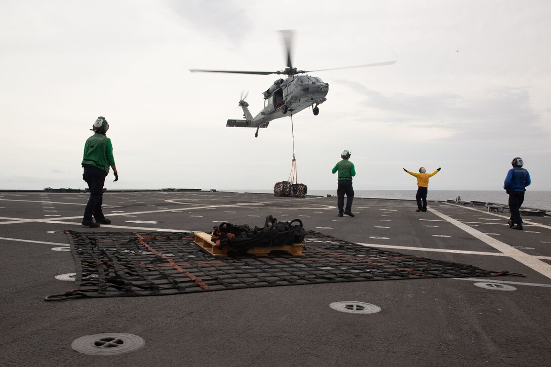 EASTERN PACIFIC OCEAN – Sailors aboard the Independence-class littoral combat ship USS Gabrielle Giffords (LCS 10) conduct a vertical replenishment Nov. 25, 2020