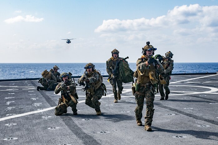 U.S. Marines hold security aboard dock landing ship USS Ashland (LSD 48), in the Philippine Sea, Jan. 24.