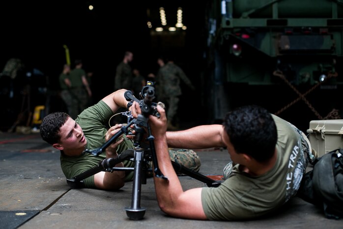 U.S. Marines conduct gun drills aboard dock landing ship USS Ashland (LSD 48), in the Philippine Sea, Jan. 25.