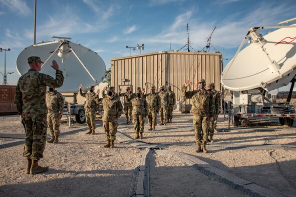 Airmen stand at attention