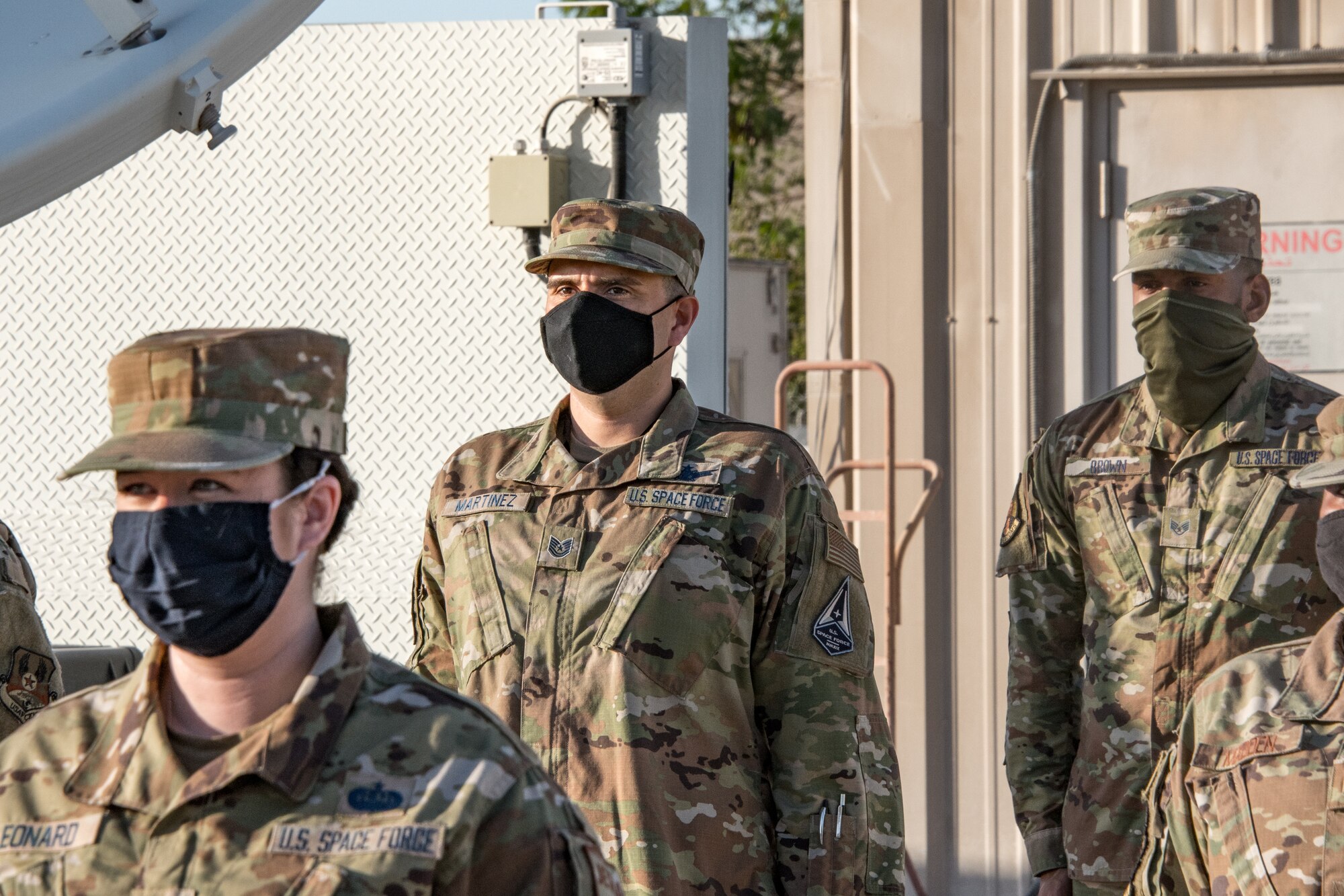 Airmen stand at attention