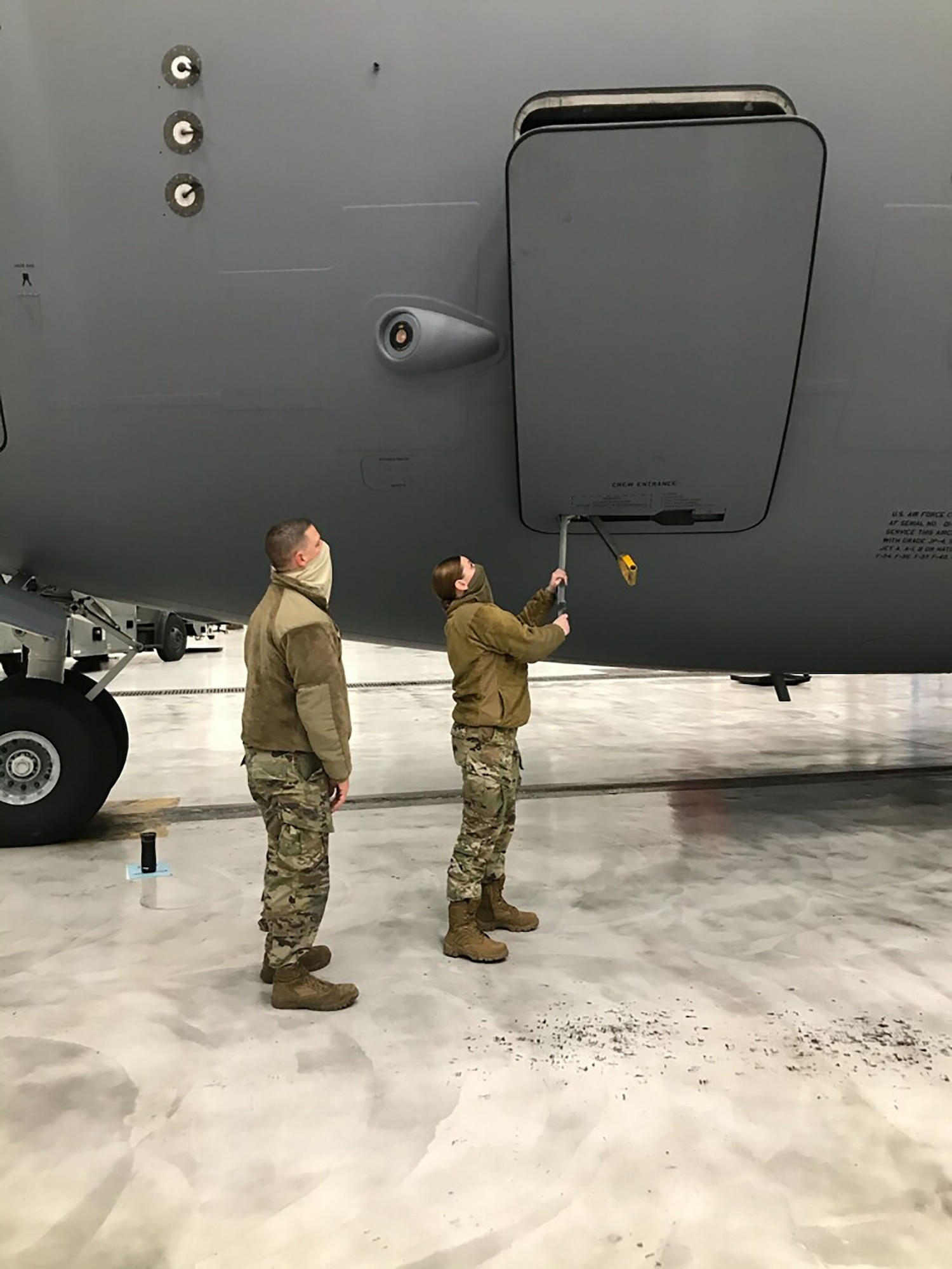 New kid on the block
445th Aircraft Maintenance Squadron Reserve Citizen Airmen Tech. Sgt. Jeremie Jamito trains new electrician, Amn. Jenna Gassawaysteere on opening and closing the doors of a C-17 Globemaster III aircraft Jan. 14, 2021.  Gassawaysteere was also taught hot to egress the jet in case of an emergency.