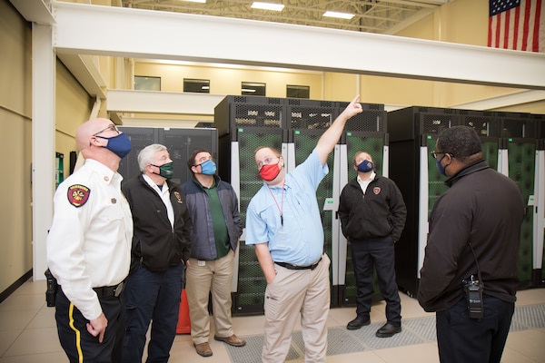 U.S. Army Engineer Research and Development Center (ERDC) Fire Officer Ernest “Lee” Williams points out safety features to Vicksburg Fire Department Chief Craig Danczyk, Assistant Chief Tim Love, ERDC Safety and Environmental Management Office’s Bobby McComas, Deputy Fire Chief Trey Martin and Fire Inspector/Investigator Nathaniel Williams during a pre-planning site visit at the Information Technology Laboratory in Vicksburg, Mississippi, Jan. 28, 2021