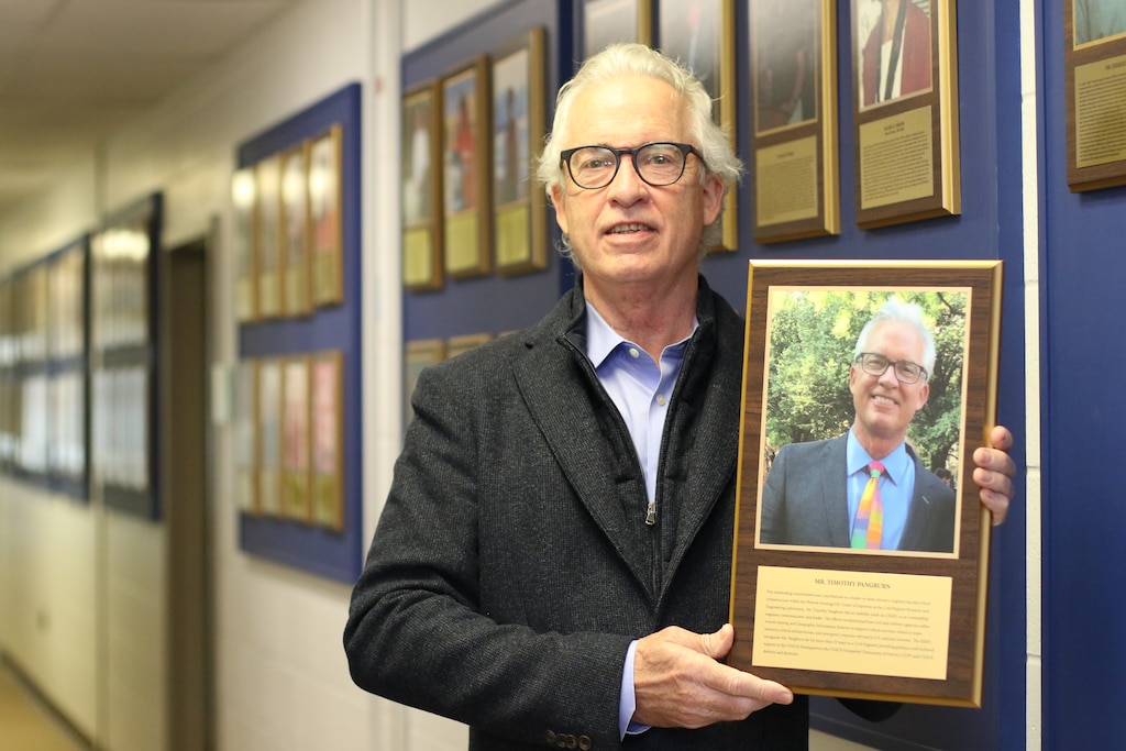 Tim Pangburn adds his portrait to the Cold Regions Research and Engineering Laboratory (CRREL) Gallery of Distinguished Employees in Hanover, N.H., Dec. 3, 2002. Panburn started working for CRREL in 1978 as a civil engineering technician, until his retirement in 2017 as a director for the U.S. Army Corps of Engineers Remote Sensing/Geographic Information Systems Center of Expertise.

The CRREL Gallery of Distinguished Employees was established in 1986 as part of the laboratory’s Silver Jubilee Year. The first distinguished employee recognized in the gallery is W. Keith Boyd, the first CRREL technical director. Boyd facilitated the 1961 establishment of CRREL in Hanover, and his leadership enhanced CRREL’s stature and reputation as a leader in cold regions research throughout the world. (U.S. Army Photo by David Marquis)