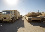 Humvees, M2 Bradley Fighting Vehicles and other vehicles are staged for transfer at the Port of Shuaiba for the upcoming Iron Union exercise Jan. 21, 2020 at the Port of Shuaiba, Kuwait. The equipment and rolling stock will go through the same process in the United Arab Emirates once the Iron Union 14 exercise has concluded. The 1185th DDSB will coordinate with adjacent units in the UAE to receive the stock back at the Port of Shuaiba. (U.S. Army photo by Spc. Zoran Raduka, 1st TSC Public Affairs)