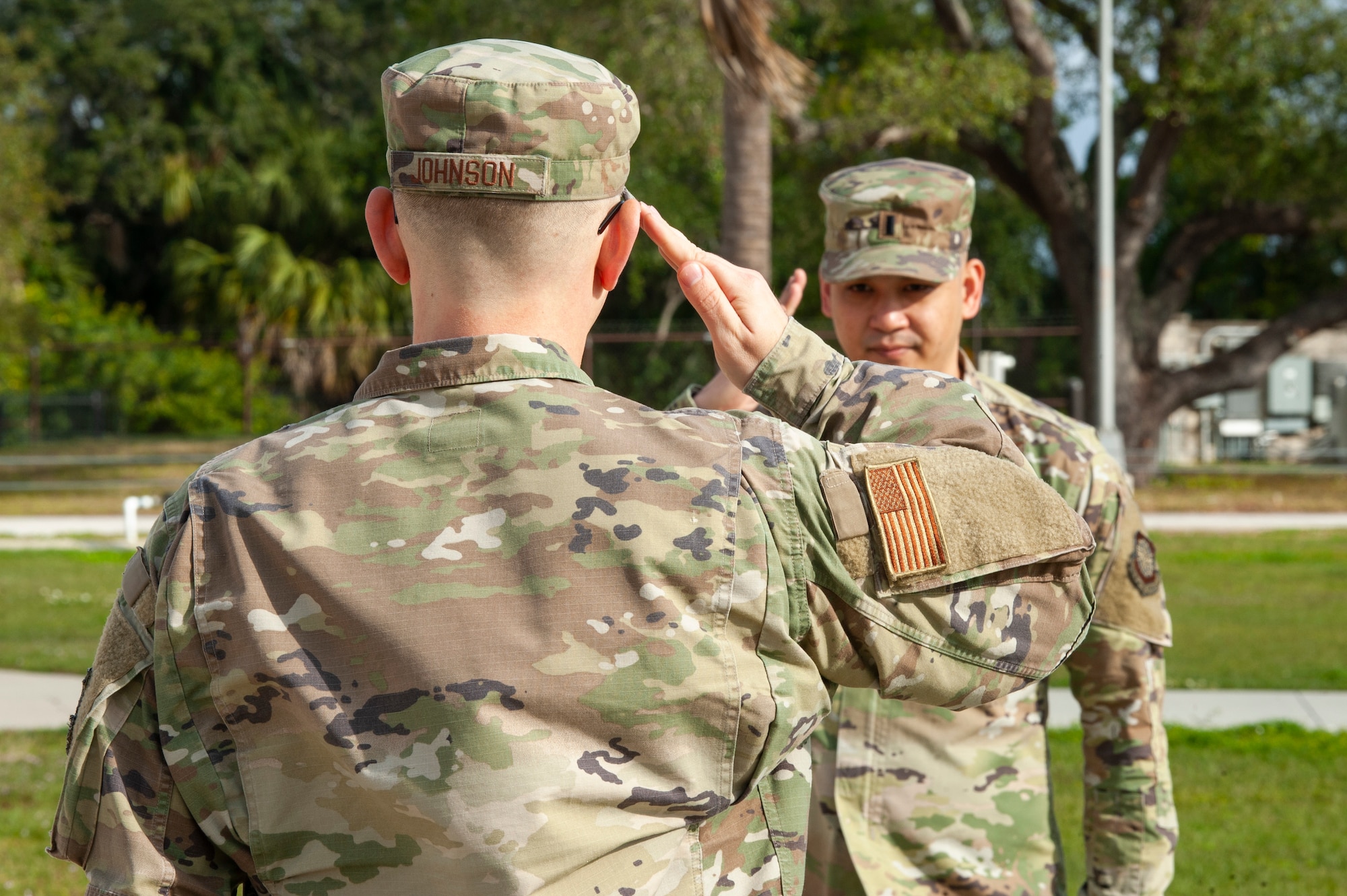 U.S. Air Force Staff Sgt. Dylan Johnson, a 6th Communication Squadron mission defense analyst, participates in a U.S. Space Force oath of enlistment ceremony administered by 1st Lt. Darren Diones, the 6th Mission Support Group executive officer, at MacDill Air Force Base, Fla., Feb. 1, 2021.