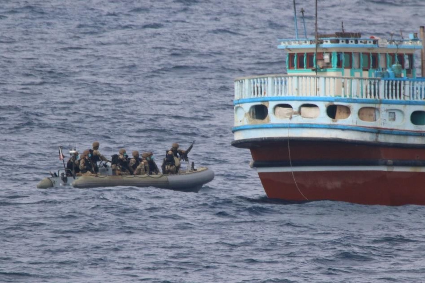 Sailors from USS Philippine Sea (CG 58) interdict a suspected drug shipment in the north Arabian Sea.