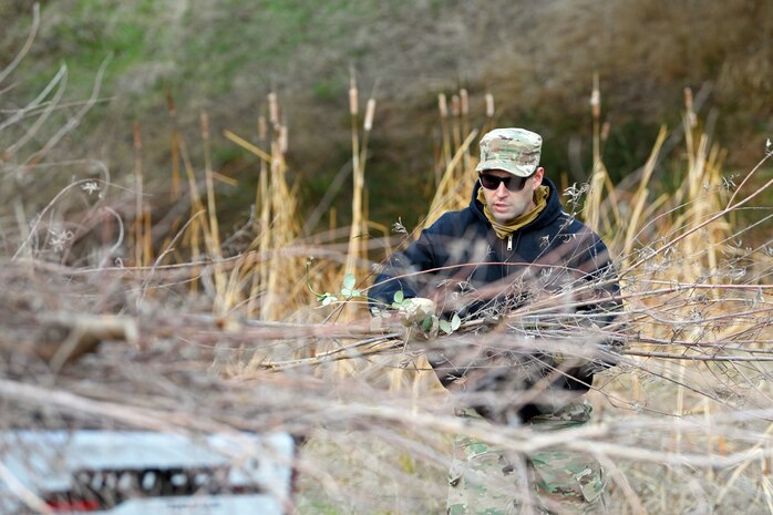 Staff Sgt. Daniel Eaton, 9th Civil Engineering Squadron pavement and construction equipment specialist, loads an all-terrain vehicle with cut down trees, Jan. 8 2020, at Beale Air Force Base, California. The trees were cut down as a flood prevention effort. (U.S. Air Force photo by Airman 1st Class Luis A. Ruiz-Vazquez)