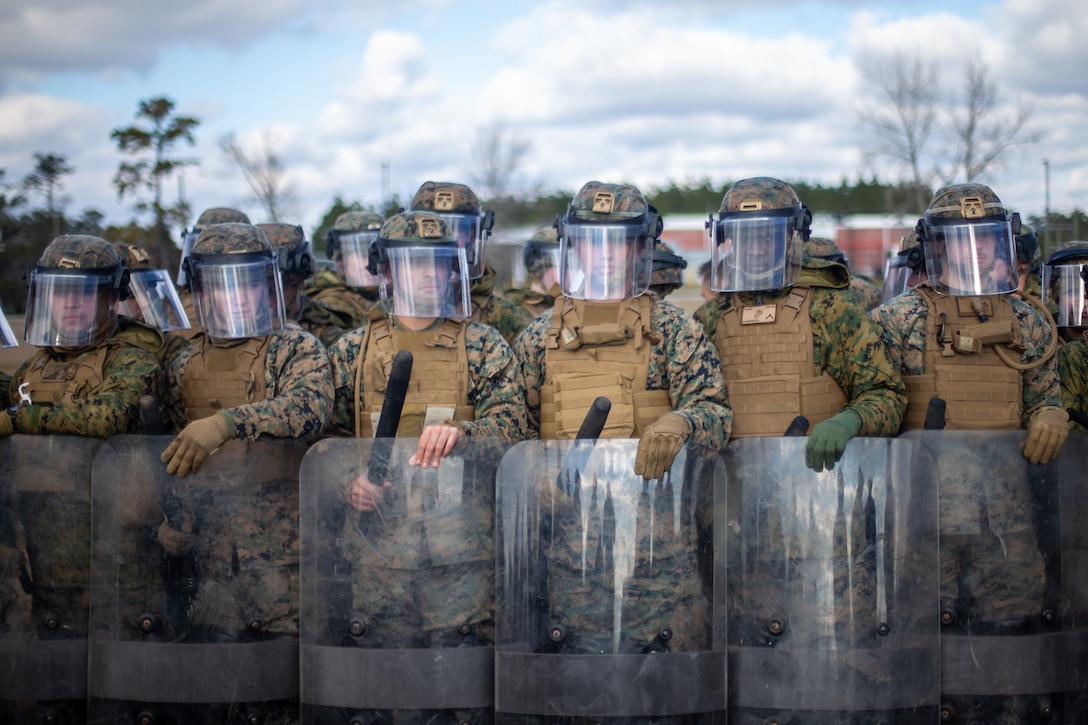 U.S. Marines prepare to hold a defensive line during a non-lethal weapons training course on Camp Lejeune, N.C., Jan. 28.