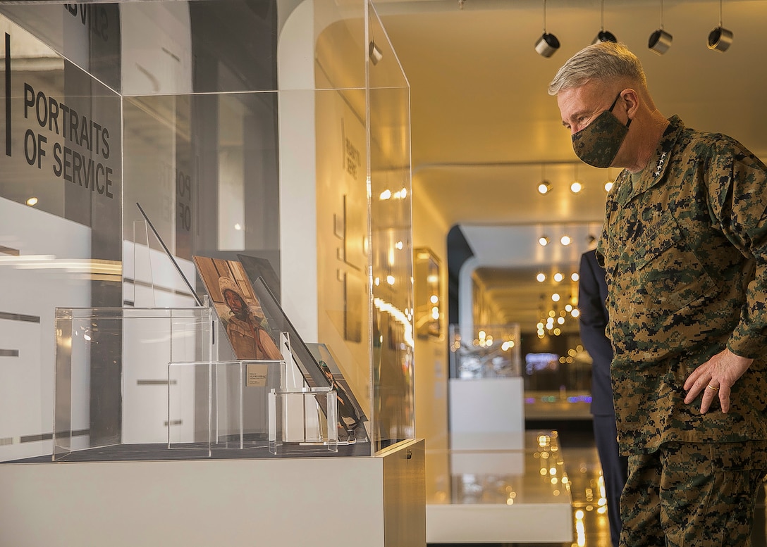 U.S. Marine Corps Gen. Kenneth F. McKenzie, Jr., the commander of U.S. Central Command, views a piece of the “MacDill Air Force Base at Home and Abroad” art display at Tampa International Airport, Fl., Feb. 1, 2021. The new exhibit is a collection of commissioned artwork and photos depicting the various branches of the military and the lives of those who serve in Southwest Asia. (U.S. Marine Corps photo by Sgt. Roderick Jacquote)