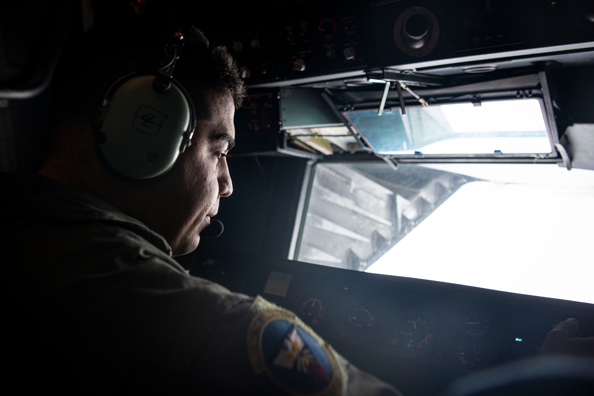Photo of an Airman performing a pre-flight check.