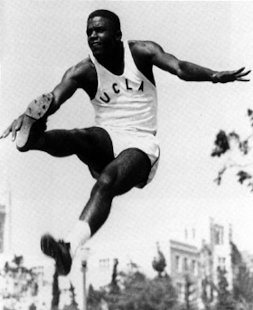 An athlete jumps high into the air.