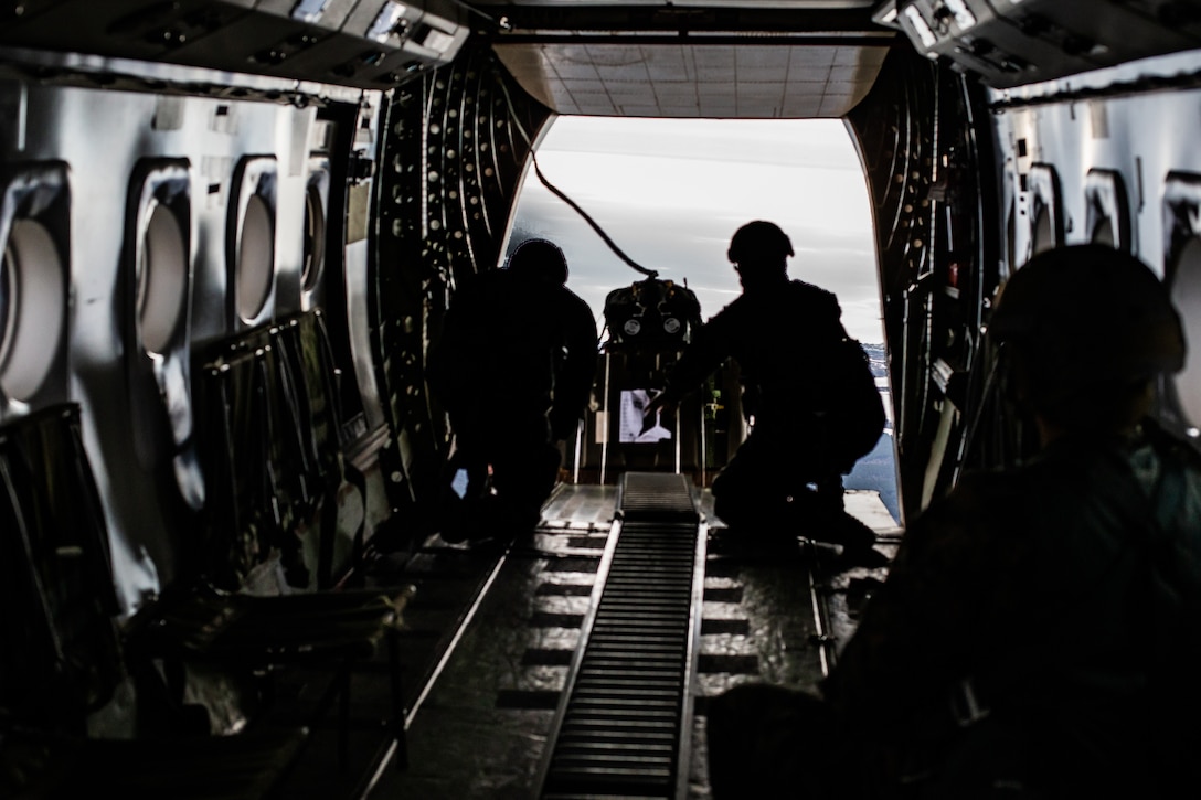U.S. Marines send an ultra-lightweight Joint Precision Airdrop System out of the back of a CASA C-212 airplane on Camp Lejeune, N.C., Jan. 11.