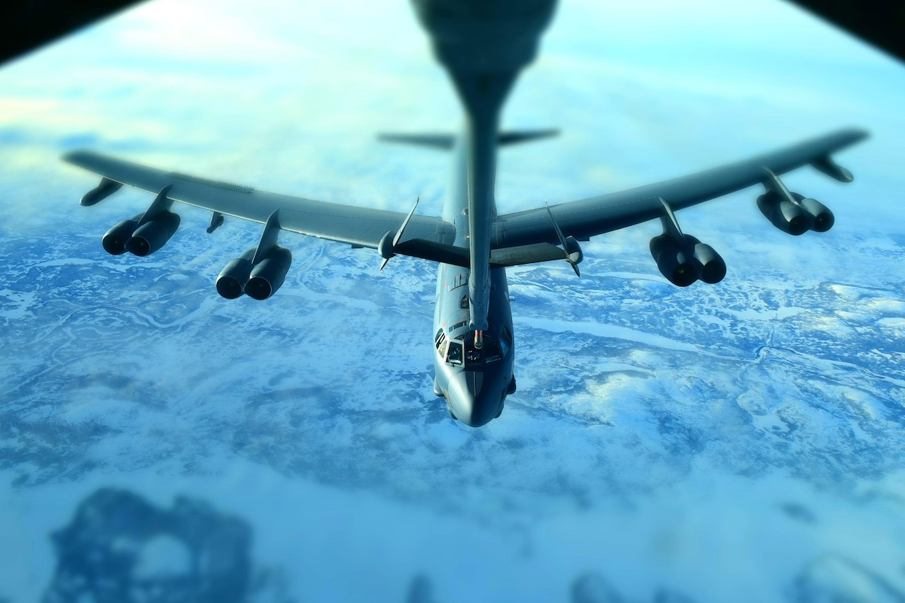 An airplane is refueled in midair.