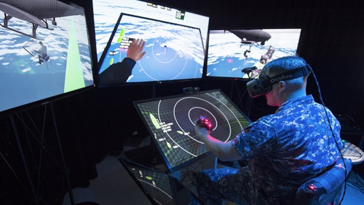 Military virtual reality training. US soldier using a virtual reality headset to train for a mission. This training is taking place at the Office of Naval Research (ONR)-sponsored Battlespace Exploitation of Mixed Reality (BEMR) laboratory located at the Space and Naval Warfare Systems Center Pacific, San Diego, California, USA. BEMR is designed to showcase and demonstrate cutting edge low cost commercial mixed reality, virtual reality and augmented reality technologies and to provide a facility where war fighters, researchers, government, industry and academia can collaborate. Photographed on 14 September 2015.