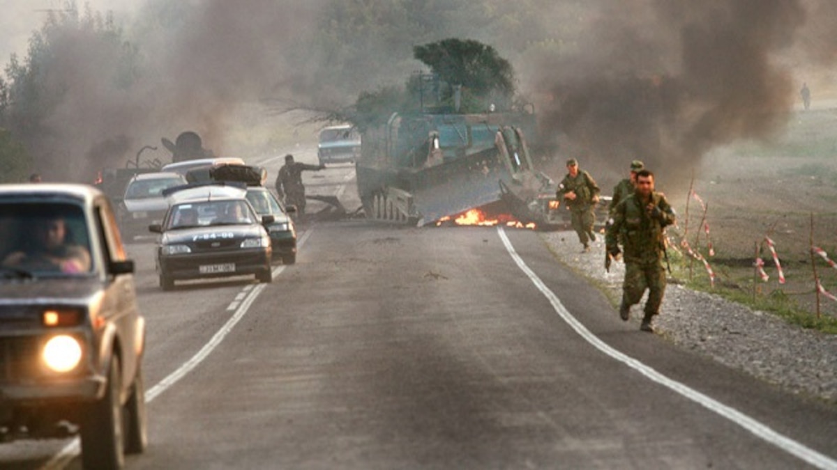GORin the disputed region. (Photo by Uriel Sinai/Getty Images)I, GEORGIA - AUGUST 11: (ISRAEL OUT) Georgian soldiers escape their burning armoured vehicle on the road to Tbilisi on August 11, 2008 just outside Gori, Georgia. Russia called today for Georgian forces to surrender in the separatist enclave of Abkhazia after Georgia called a ceasefire and withdrew their forces from South Ossetia, leaving Russian forces now firmly in control