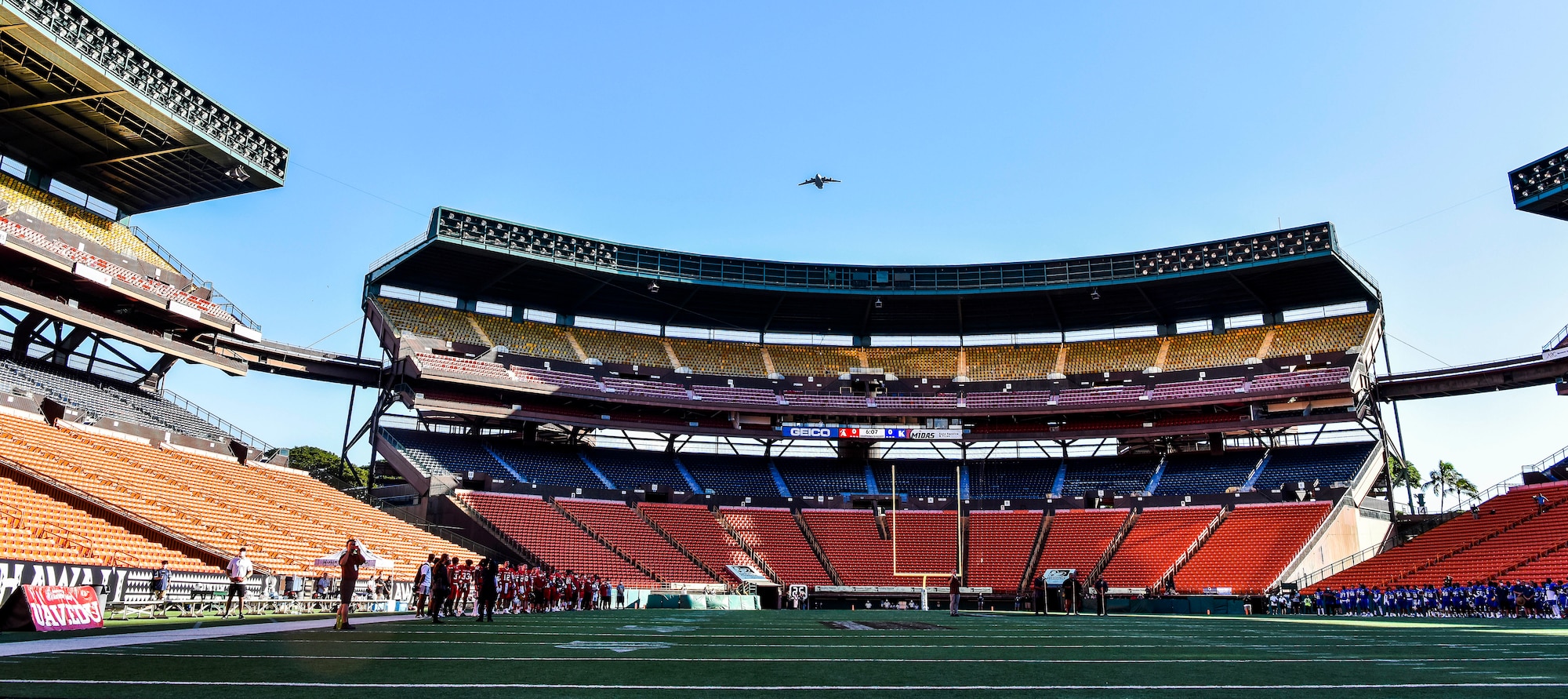 A U.S. Air Force C-17 Globemaster III from the 535th Airlift Squadron flies over the 2021 Hula Bowl in Honolulu, Hawaii, Jan. 31, 2021. The C-17 Globemaster III is capable of rapid strategic delivery of troops and all types of cargo to main operating bases or directly to forward bases in the deployment area. (U.S. Air Force photo by Tech. Sgt. Anthony Nelson Jr.)