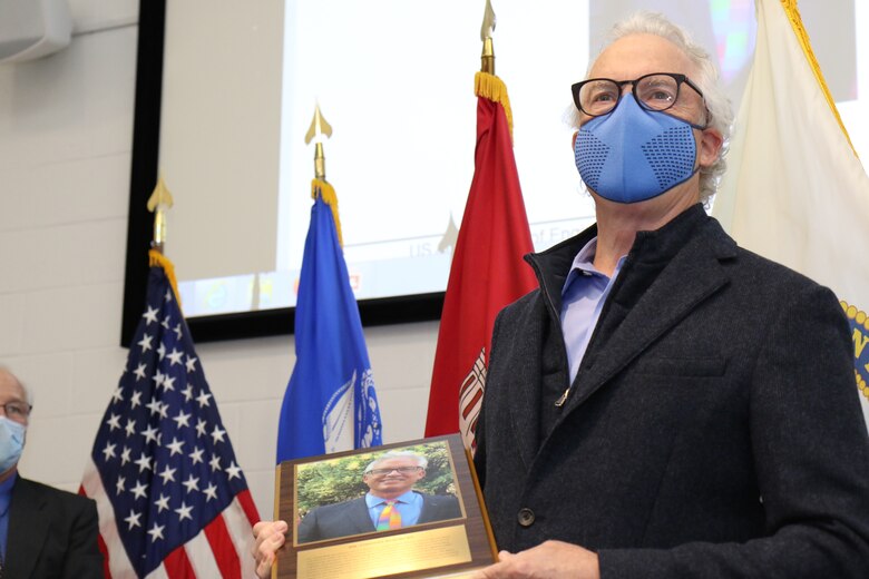 031220-A-LI860-035
Tim Pangburn receives the 2020 Distinguished Employee Award during a ceremony at the Cold Regions Research and Engineering Laboratory (CRREL) in Hanover, N.H., Dec. 3, 2020. CRREL Director Dr. Joseph Corriveau presented Pangburn with the award to recognize his lifelong commitment to civil service between 1978 until his retirement in 2017.

Pangburn’s portrait will be immortalized in the CRREL Gallery of Distinguished Employees, which was established in 1986 as part of the laboratory’s Silver Jubilee Year. The first Distinguished Employee recognized in the gallery is W. Keith Boyd, the first CRREL technical director. Boyd facilitated the 1961 establishment of CRREL in Hanover, and his leadership enhanced CRREL’s stature and reputation as a leader in cold regions research throughout the world. (U.S. Army Photo by David Marquis)