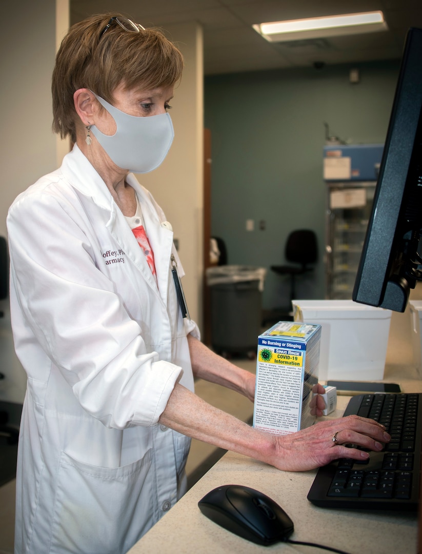 Julia Coffey, Doctor of Pharmacy, verifies prescriptions at the Community Pharmacy in the Exchange at Joint Base San Antonio-Fort Sam Houston Feb. 1. The new pharmacy is about 1,600 square feet larger than the old location and is designed to allow a better overall operational flow and more work space for the pharmacy team to safely work.