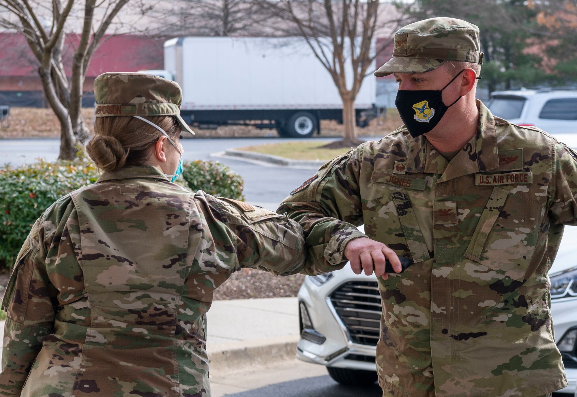 Col. Matthew Jones, 436th Airlift Wing commander, greets 1st Lt. Morgan Prestridge, 436th Mission Support Group executive officer, at a hotel in Baltimore, Maryland, Jan. 15, 2021. The hotel serves as an isolation location for Patriot Express service members who test positive for COVID-19 at the Baltimore/Washington International Thurgood Marshall Airport testing center. These service members and their families receive medical care and follow-on logistical support from Dover Air Force Base personnel. (U.S. Air Force photo by Senior Airman Christopher Quail)
