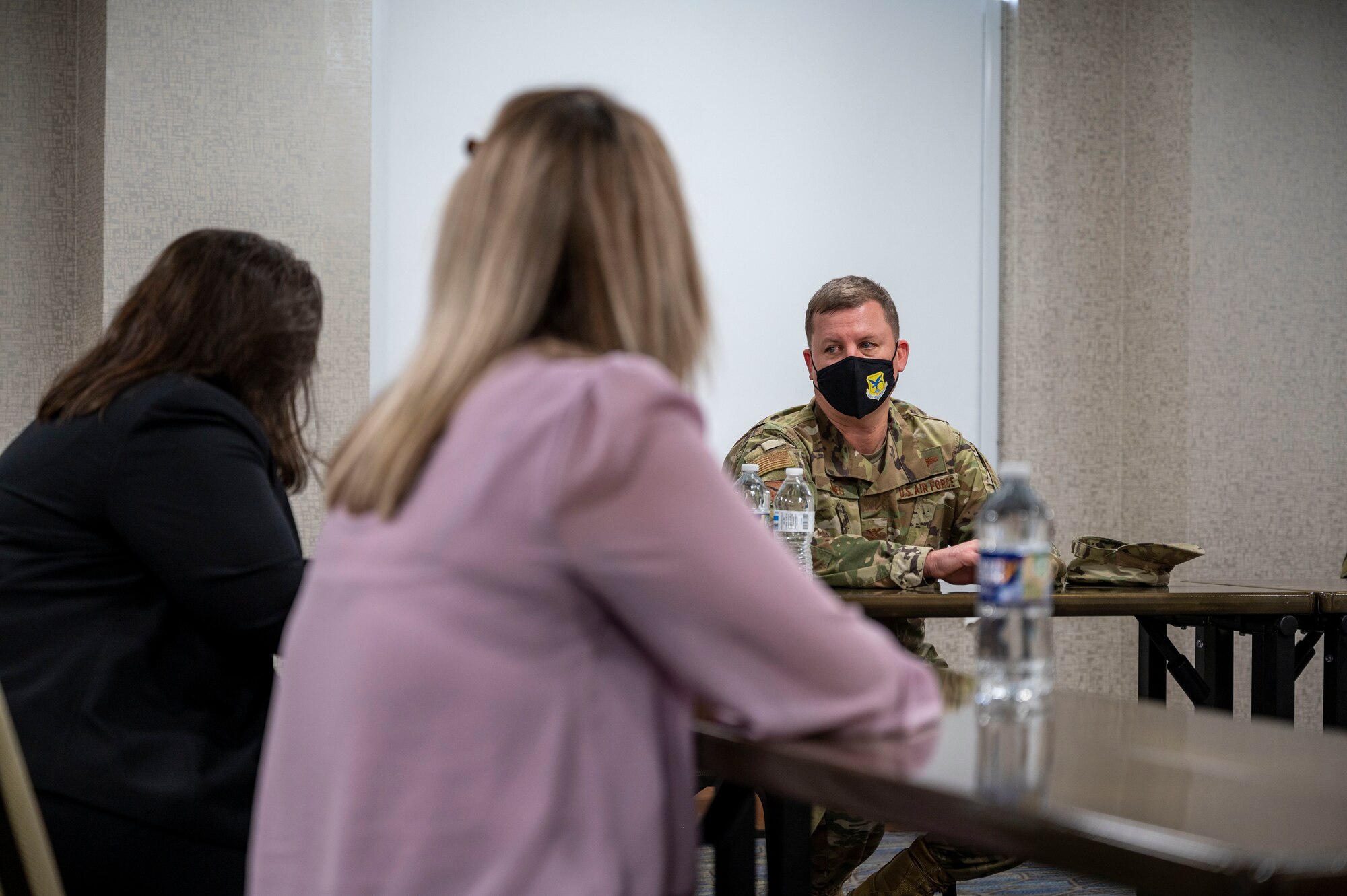 Col. Matthew Jones, 436th Airlift Wing commander, speaks at a roundtable discussion at a hotel in Baltimore, Maryland, Jan. 15, 2021. The hotel serves as an isolation location for Patriot Express service members who test positive for COVID-19 at the Baltimore/Washington International Thurgood Marshall Airport testing center. These service members and their families receive medical care and follow-on logistical support from Dover Air Force Base personnel. (U.S. Air Force photo by Airman 1st Class Cydney Lee)