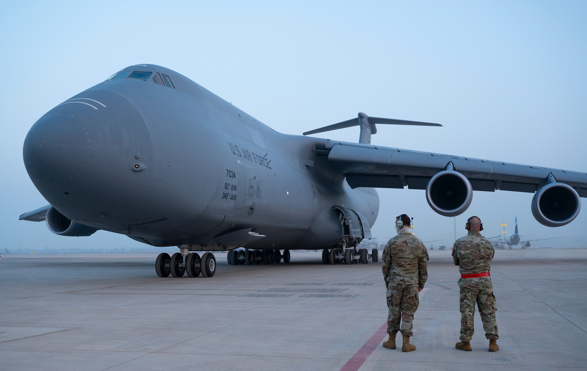 U.S. Air Force 1st Lt. Eric Reside, a 34th Expeditionary Bomb Squadron maintenance officer in charge, and Chief Master Sgt. Galen Scoble, a 34th EBS superintendent, stand by to welcome 34th EBS Airmen to India at Kempegowda International Airport in Bengaluru, India, Feb. 1, 2021. Approximately 50 Airmen traveled from Ellsworth Air Force Base, S.D., to Bengaluru in support of the B-1B Lancer’s participation in Aero India 2021. Aero India is the largest trade show in the Indo-Pacific, attracting a large number of exhibitors from around the world, with a large number of Department of Defense leadership in attendance.  (U.S. Air Force photo by Senior Airman Christina Bennett)