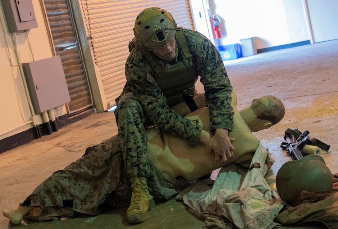 U.S. Marine Corps Lance Cpl. Samuel Smith, with 3d Reconnaissance Battalion, 3d Marine Division, takes the final practical application exam during Tactical Combat Casualty Care training at Camp Hansen, Okinawa, Japan, Jan. 20, 2021. TCCC training reinforces Marines and Sailors’ ability to provide lifesaving care and to limit the risk of casualties on the battlefield. (U.S. Marine Corps photo by Lance Cpl. Juan Carpanzano)