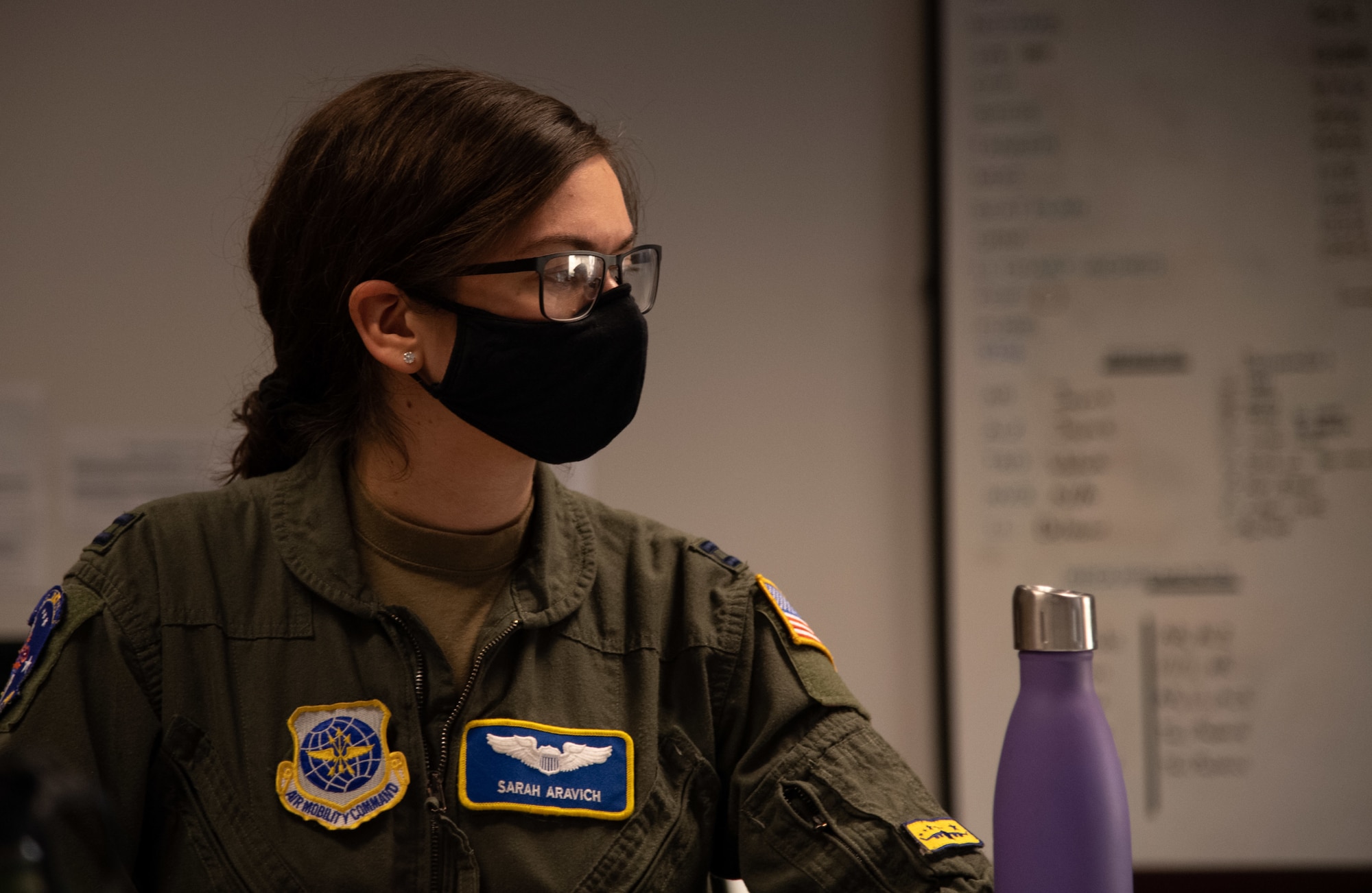 Capt. Sarah Aravich, 3rd Airlift Squadron pilot, attends a mission briefing at Dover Air Force Base, Delaware, Jan. 28, 2021. Night missions serve to ensure aircrew effectiveness and readiness in contested and challenging environments. The 3rd AS routinely trains to support global engagement through direct delivery of time-critical theater deployment assets and ensure aircrew operational readiness. (U.S. Air Force photo by Airman 1st Class Faith Schaefer)