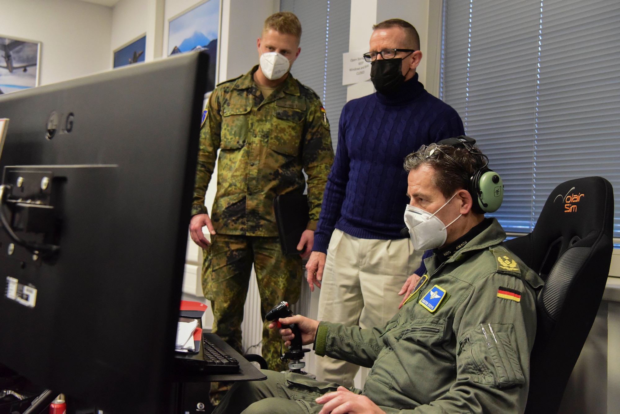 German Maj. Gen. Karsten Stoye, chief of staff at NATO’s Headquarters Allied Air Command, tests the flight simulator during the Spartan Warrior 21-1 exercise at Einsiedlerhof Air Station, Germany, Jan. 25-28, 2021.
