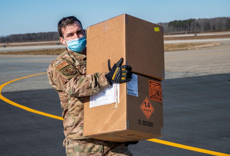 Staff Sgt. Deric Sexton, 436th Aerial Port Squadron load planner, delivers foreign military sales cargo to a Tunisian air force C-130J Super Hercules at Dover Air Force Base, Delaware, Jan. 28, 2021. The U.S. and Tunisia have enjoyed strong diplomatic relations for over 200 years, a special bond first enshrined when the two countries signed the Treaty of Peace and Friendship in 1797. Tunisia was among the first to recognize the newly independent U.S. during that time. Due to its strategic geographic location, Dover AFB supports approximately $3.5 billion worth of FMS operations annually. (U.S. Air Force photo by Senior Airman Christopher Quail) (This image was altered for security purposes by blurring identification on cargo)