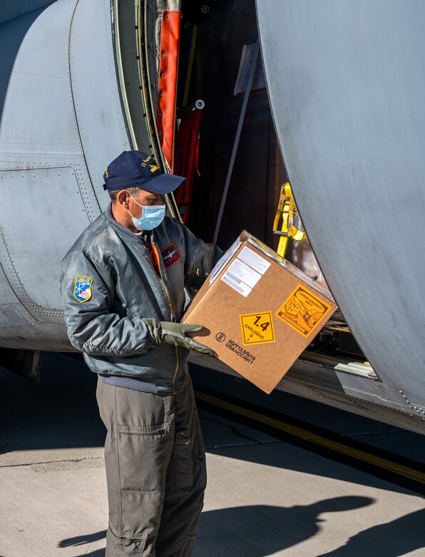 A Tunisian air force airman inspects a box during a foreign military sales mission at Dover Air Force Base, Delaware, Jan. 28, 2021. The U.S. was the first major power to recognize Tunisian sovereignty and established relations with Tunisia in 1956 following its independence from France. Since then, Tunisia has become an even more critical partner and a major non-NATO ally, which entails military and economic privileges and is a powerful symbol of the close relationship between the U.S. and Tunisia. Tunisia was among the first to recognize the newly independent U.S. during that time. Due to its strategic geographic location, Dover AFB supports approximately $3.5 billion worth of FMS operations annually. (U.S. Air Force photo by Senior Airman Christopher Quail) (This image was altered for security purposes by blurring identification on cargo)