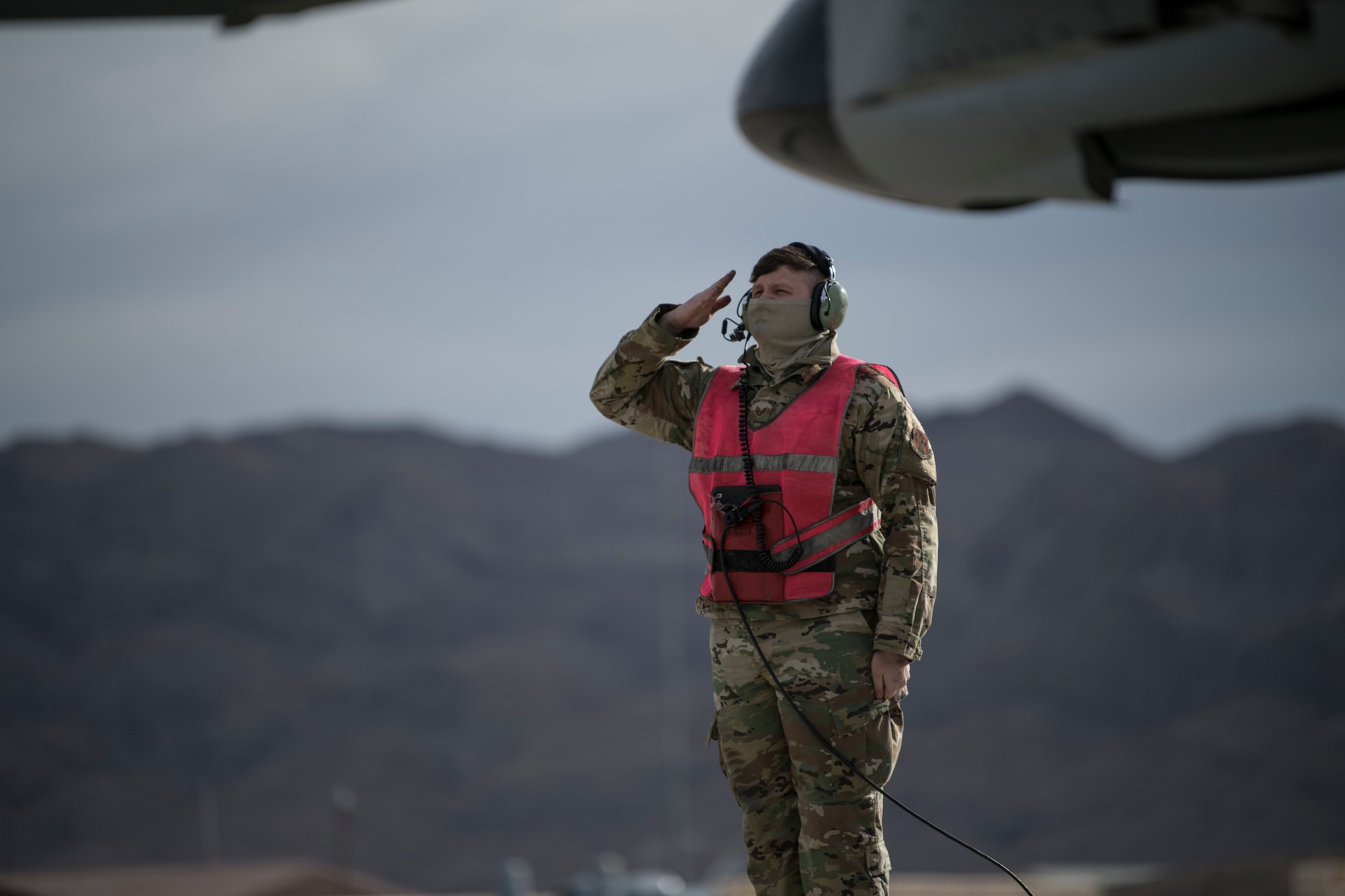 U.S. Air Force Tech. Sgt. Kacey Johnson, aircraft ordinance systems technician, assigned to the 122nd Fighter Wing, Fort Wayne, Indiana, salutes an A-10C Thunderbolt II pilot before flight at Red Flag 21-1, Nellis Air Force Base, Nevada, Jan. 23, 2021. The event, held several times per year, is a U.S. Air Force premier air-to-air combat training exercise. (U.S. Air National Guard photo by Staff Sgt. Justin Andras)
