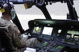 Chief Warrant Officer 2 Paul Schroader, an aviator with C Co, 5-159th GSAB based at Fort Knox, Kentucky, goes through instrument flight rules (IFR) flying in the new state-of-the-art Black Hawk Aircrew Trainer (BAT). The simulator is configured to give helicopter pilots refresher training on the UH-60M and UH-60L.