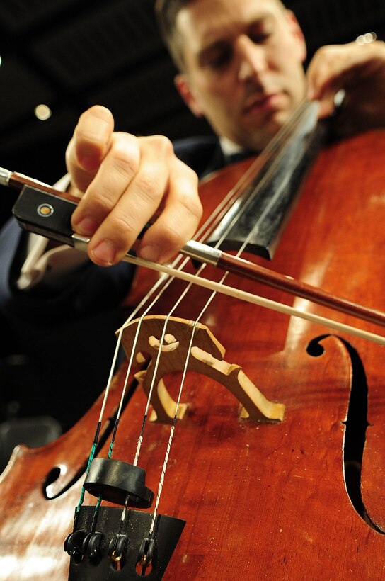 Senior Master Sgt. Josh Kowalsky, cellist with the Air Force Strings, performs during one of many orchestra concerts throughout the year (U.S. Air Force photo by Chief Master Sgt. (ret) Bob Kamholz)