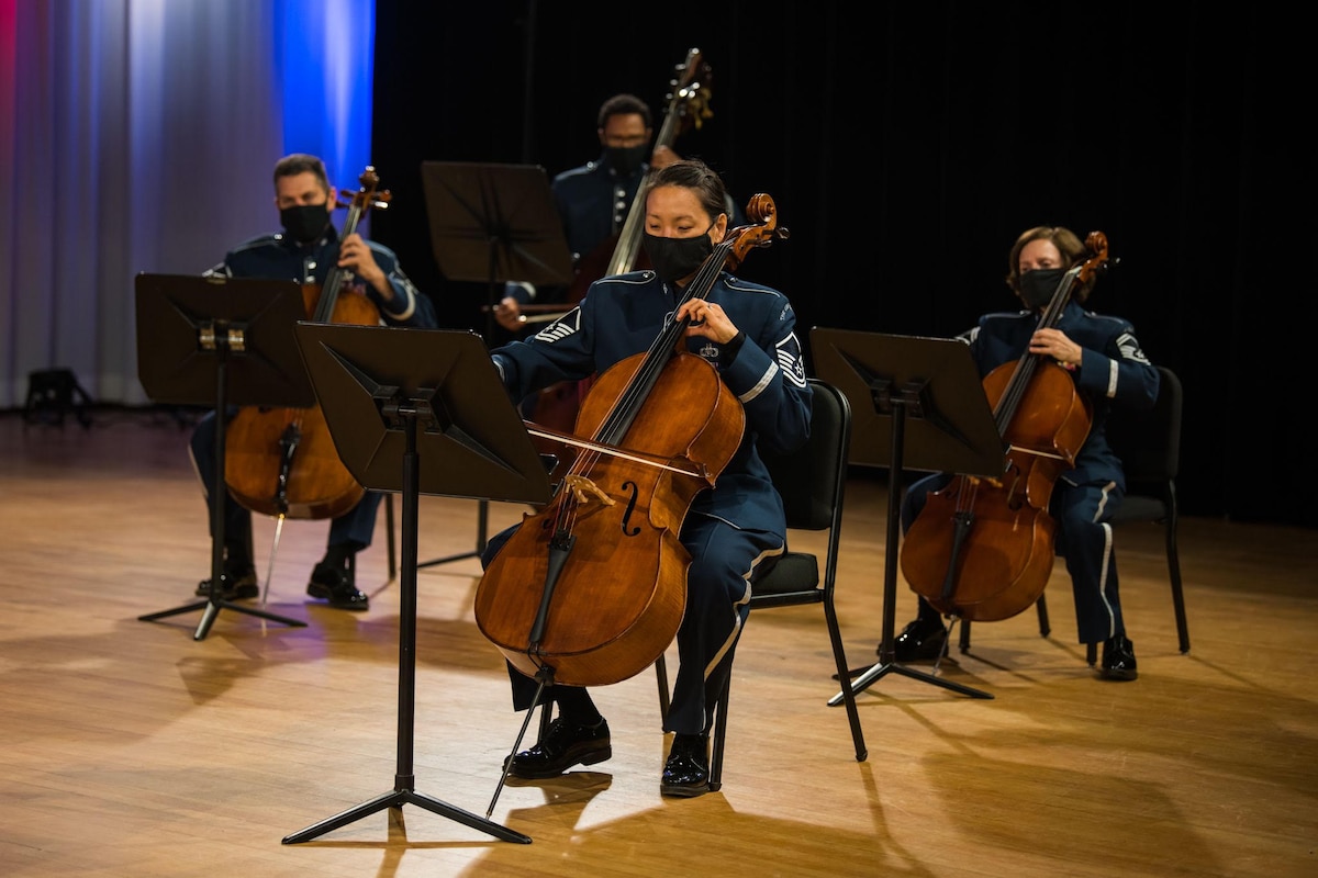 Members of the U.S. Air Strings cello section perform during a video taping of the broadcast: American Valor, sponsored by the American Veteran Center.  (U.S. Air Force photo by Chief Master Sgt. Kevin Burns)