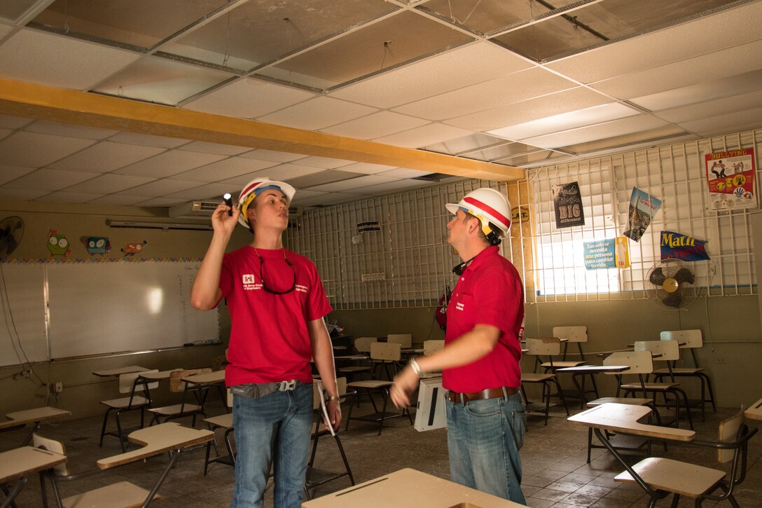 U.S. Army Corps of Engineers, Structural Engineers, Ariel A. Marrero Irizarry and Christopher R. Bamberg, assess a school in Carolina, Puerto Rico on October 20, 2017. The Corps along with their counterparts have assessed more than 250 schools between San Juan and Mayaguez. FEMA, the Army Corps of Engineers, the Puerto Rican Department of Education, the University of Mayaguez, and a local Contractor work together in assessing over 1,032 school on the Island.