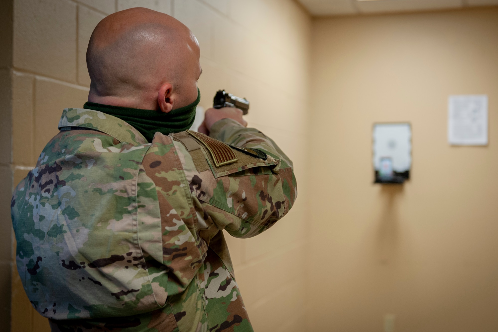 Photo of an Airman participating in a shooting exercise