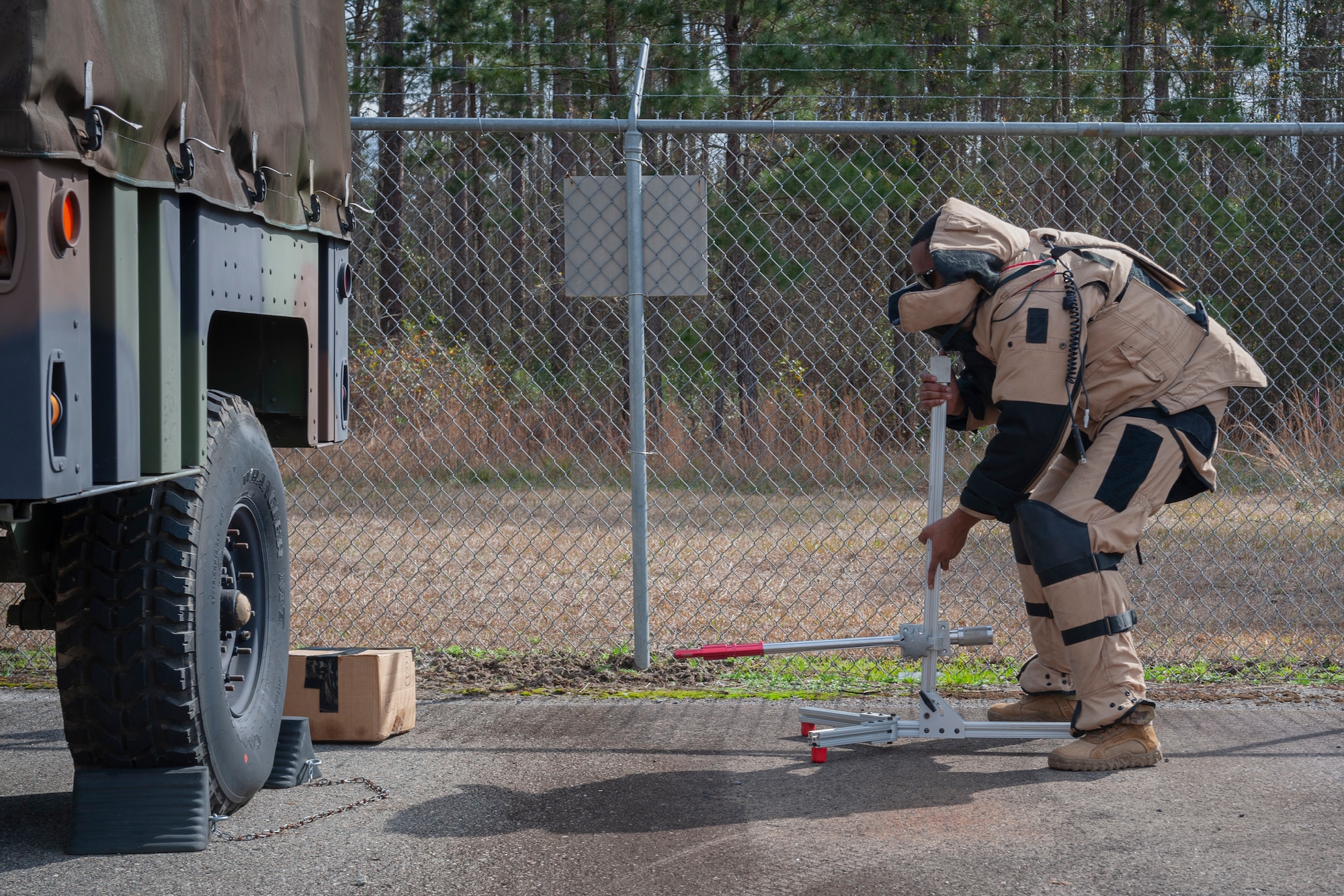 Photo of an Airman participating in a simulated bomb activity
