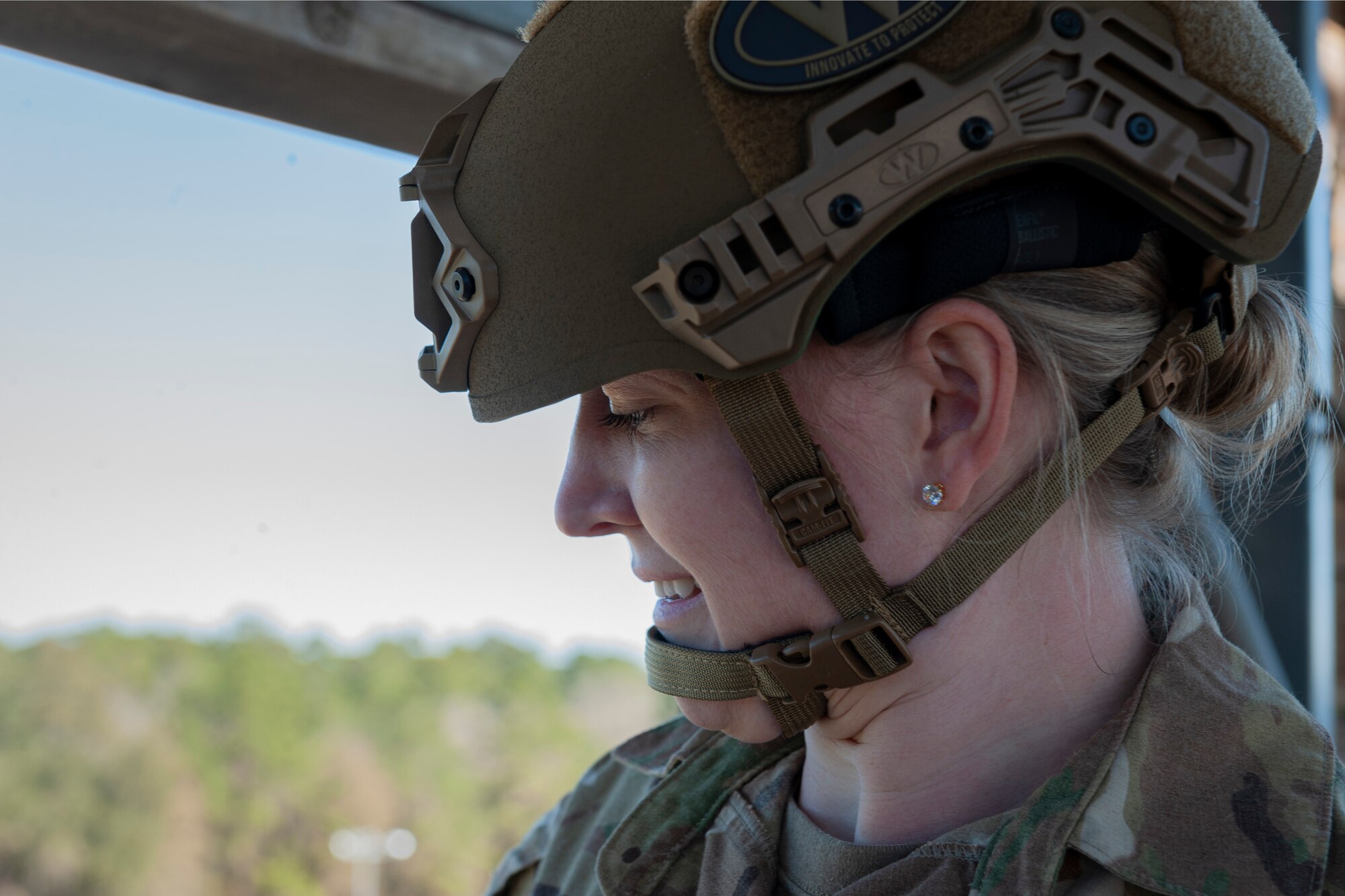 Photo of an Airman preparing to rappel from a tower