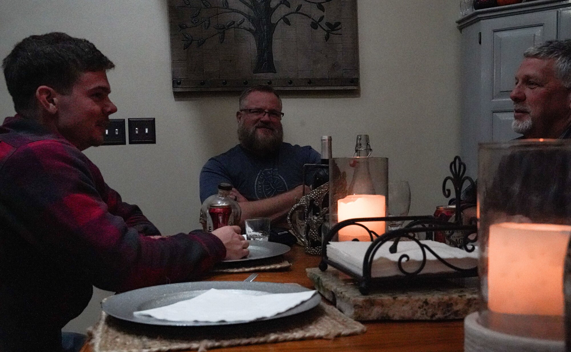 Larry Shanes sit at table with friends