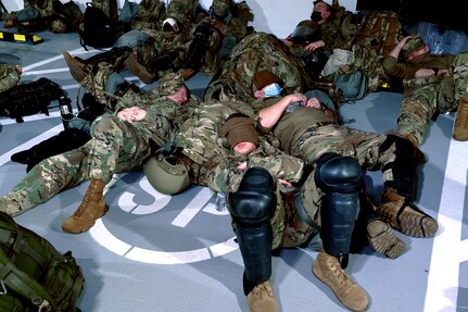 New Hampshire guardsmen slumber in a parking garage Jan. 19, 2021, in Washington, D.C. They staged there overnight to enable quick response to the Capitol area for the presidential inauguration.