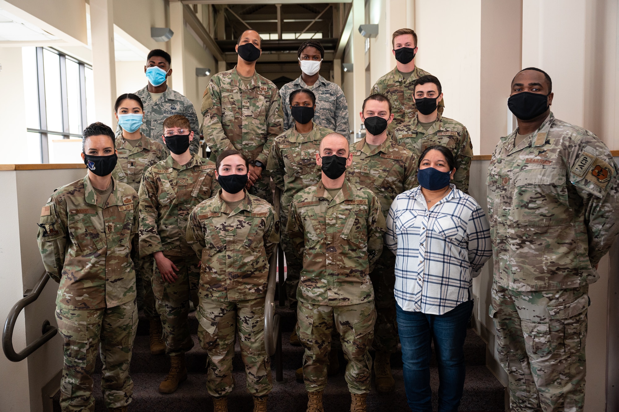 Chief Master Sgt. Kristina L. Rogers, 19th Air Force command chief master sergeant, and Chief Master Sgt. Robert L. Zackery III, 47th Flying Training Wing command chief master sergeant, pose for a photo with members from the 47th Comptroller Squadron at Laughlin Air Force Base, Texas, Jan. 29, 2020. Rogers gave special recognition to Airmen who go above and beyond their daily duties. (U.S. Air Force photo by Senior Airman Marco A. Gomez)