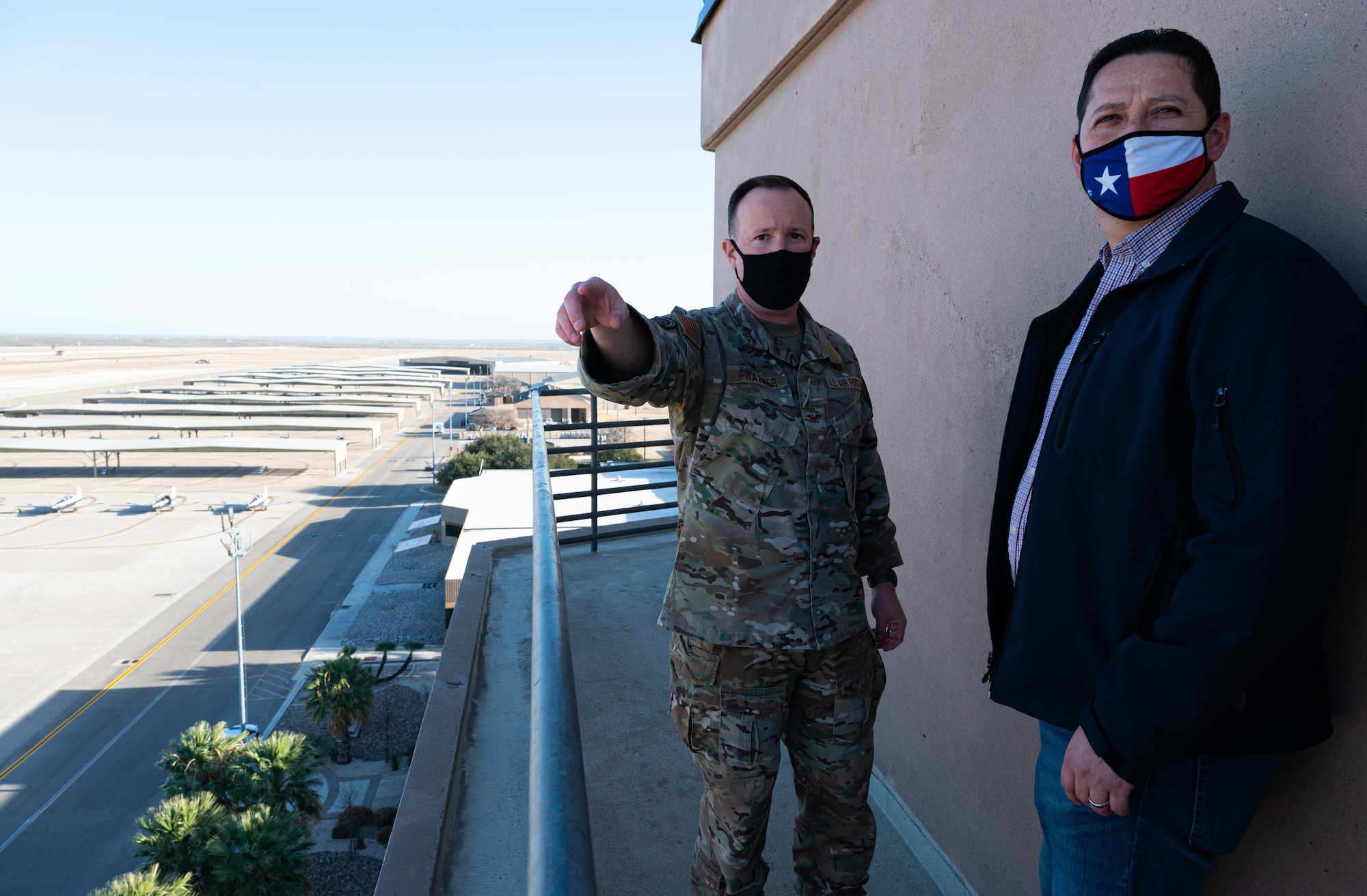 Col. Craig D. Prather, 47th Flying Training Wing commander, and Tony Gonzales, representative for Texas’ 23rd Congressional District, overlook the fleet of trainer aircraft at Laughlin Air Force Base, Texas, on Jan. 14, 2021. Gonzales paid made his first visit to Laughlin since taking office earlier in January. (U.S. Air Force photo by Senior Airman Marco A. Gomez)