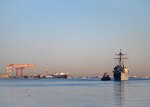 YOKOSUKA, Japan (Feb. 4, 2021) –  The Arleigh Burke-class guided missile destroyer USS Rafael Peralta (DDG 115) arrives at Fleet Activities Yokosuka after completing a homeport change from San Diego, Calif., to join U.S. 7th Fleet. The forward presence of Rafael Peralta, a Flight IIA destroyer that can deploy with 2 MH-60 variant helicopters and also has improved ballistic missile defense, anti-air and surface warfare capabilities compared to its predecessor, enhances the national securi-ty of the United States and improves its ability to protect strategic interests. As the U.S. Navy's largest forward-deployed fleet, 7th Fleet employs 50-70 ships and submarines across the Western Pacific and Indian oceans. U.S. 7th Fleet routinely operates and interacts with 35 maritime nations while conducting missions to preserve and protect a free and open Indo-Pacific Region. (U.S. Navy photo by Mass Communication Specialist 2nd Class Reymundo A. Villegas III/Released)