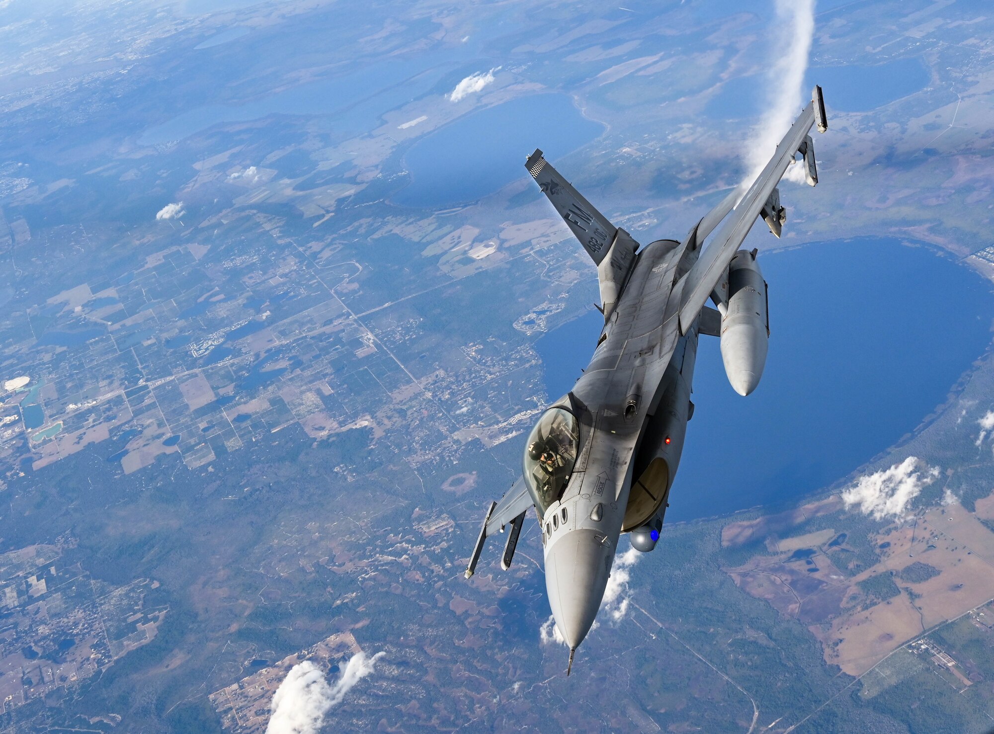 F-16s from the 93rd Fighter Squadron at Homestead Air Reserve Base, Florida, practice aerial refueling with a KC-135 Stratotanker from the 465th Air Refueling Squadron at Tinker Air Force Base, Oklahoma, Jan 27, 2021. This business effort training mission ensured that aircrew on multiple platforms received the necessary upgrade and competency training required to remain fully mission capable. (U.S. Air Force photo by Senior Airman Mary Begy)