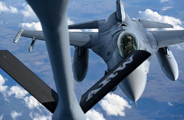 F-16s from the 93rd Fighter Squadron at Homestead Air Reserve Base, Florida, practice aerial refueling with a KC-135 Stratotanker from the 465th Air Refueling Squadron at Tinker Air Force Base, Oklahoma, Jan 27, 2021. This business effort training mission ensured that aircrew on multiple platforms received the necessary upgrade and competency training required to remain fully mission capable. (U.S. Air Force photo by Senior Airman Mary Begy)