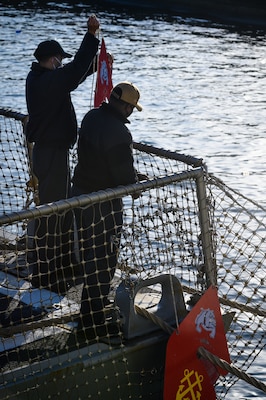 YOKOSUKA, Japan (Feb. 4, 2021) –  Sailors assigned to the Arleigh Burke-class guided missile destroyer USS Rafael Peralta (DDG 115) secure rat guards to the ship after its arrival to Fleet Activities Yokosuka after completing a homeport change from San Diego, Calif., to join U.S. 7th Fleet. The forward presence of Rafael Peralta, a Flight IIA destroyer that can deploy with 2 MH-60 variant helicopters and also has improved ballistic missile defense, anti-air and surface warfare capabilities compared to its predecessor, enhances the national securi-ty of the United States and improves its ability to protect strategic interests. As the U.S. Navy's largest forward-deployed fleet, 7th Fleet employs 50-70 ships and submarines across the Western Pacific and Indian oceans. U.S. 7th Fleet routinely operates and interacts with 35 maritime nations while conducting missions to preserve and protect a free and open Indo-Pacific Region. (U.S. Navy photo by Mass Communication Specialist 2nd Class Reymundo A. Villegas III/Released)